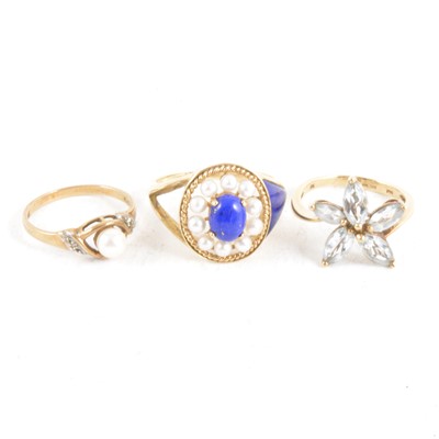 Lot 375 - Three gemset dress rings.