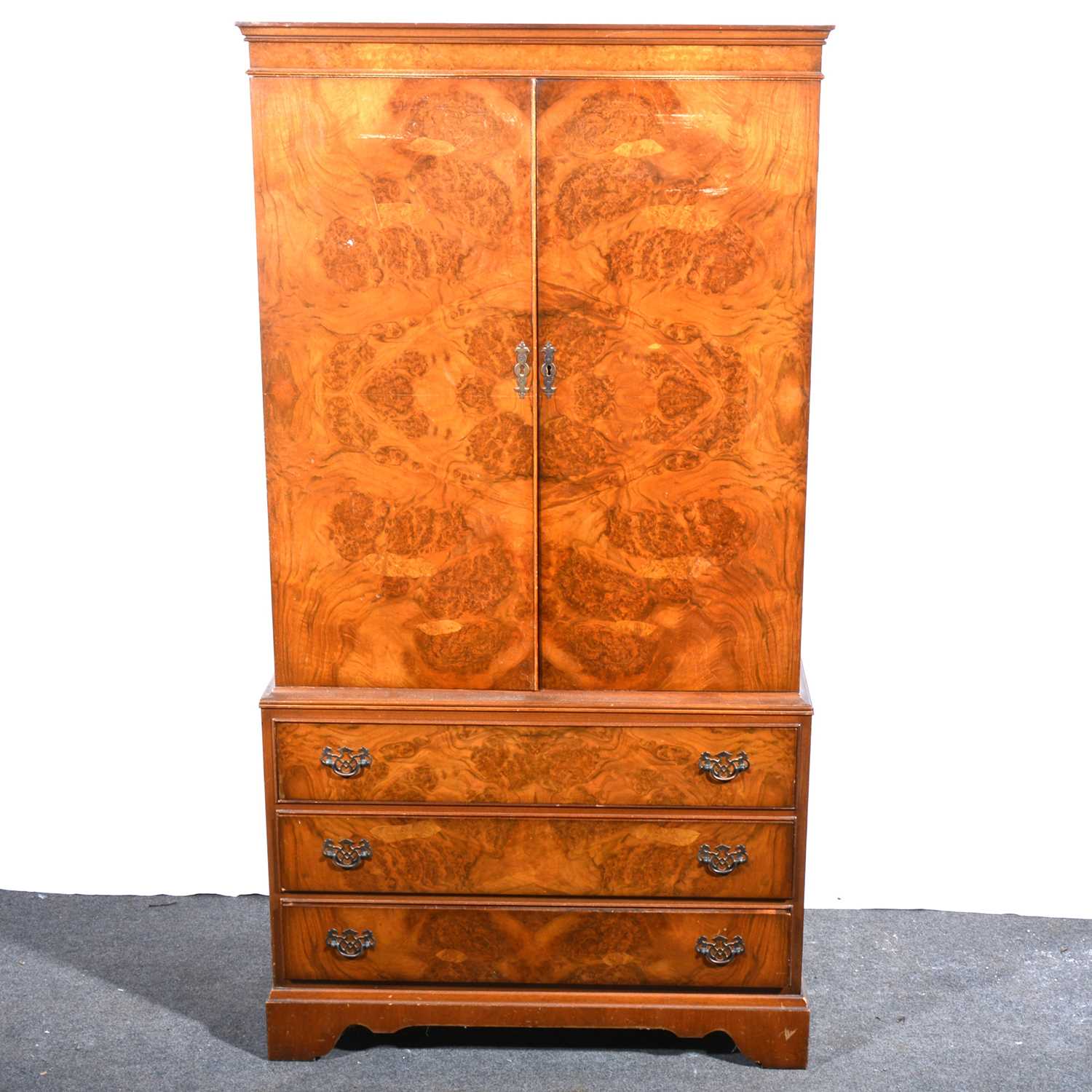 Lot 50 - A reproduction figured walnut cabinet.