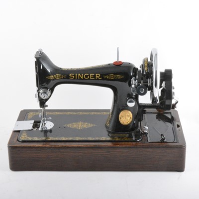 Lot 254 - A Singer hand sewing machine, cased.