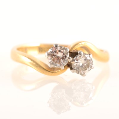 Lot 227 - A diamond two stone crossover ring.