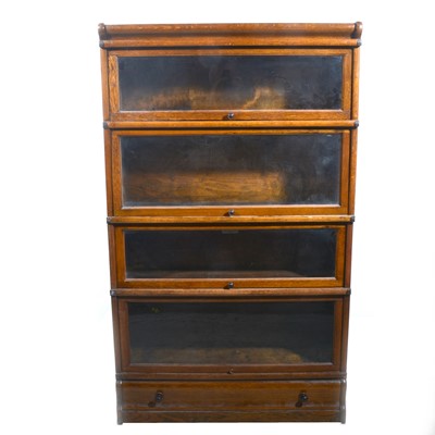 Lot 516 - Two oak Globe Wernicke type sectional bookcases