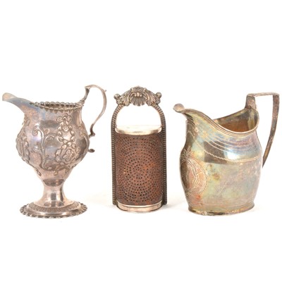 Lot 141 - Two silver cream jugs and a silver nutmeg grater