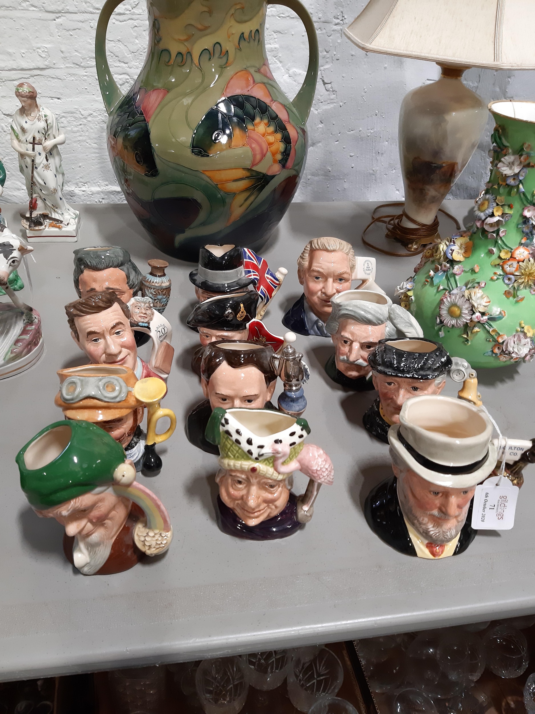 Lot 71 Twelve Royal Doulton character jugs.