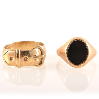 Lot 231 - Two 9 carat yellow gold rings, a buckle ring and signet.