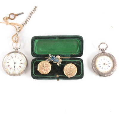 Lot 409 - Two white metal open face pocket watches, a silver chain and a pair of gold-plated cufflinks