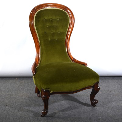 Lot 516 - A mahogany framed balloon back nursing chair