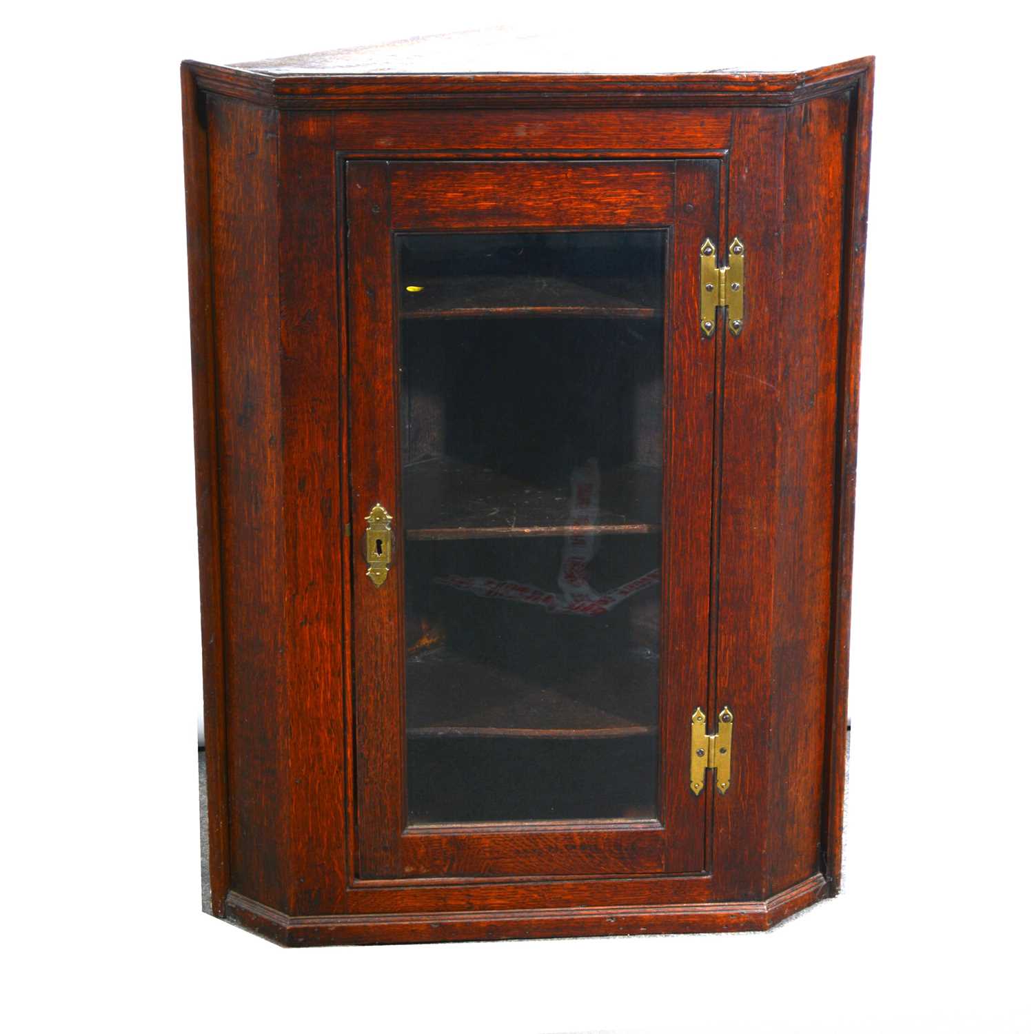 Lot 425 - An oak wall mounted corner cupboard