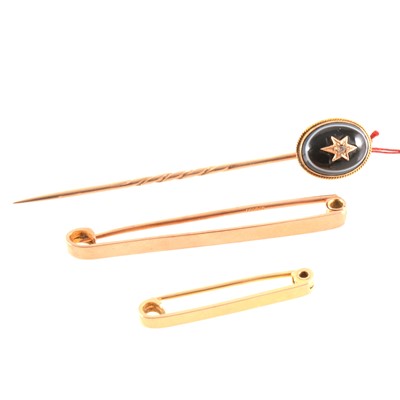 Lot 284 - Two gold tie bars and a stick pin.