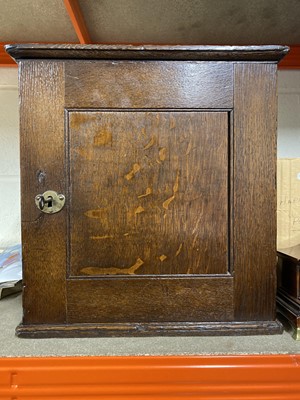 Lot 446 - George III oak spice cabinet
