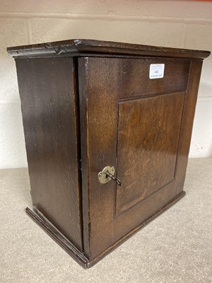 Lot 446 - George III oak spice cabinet