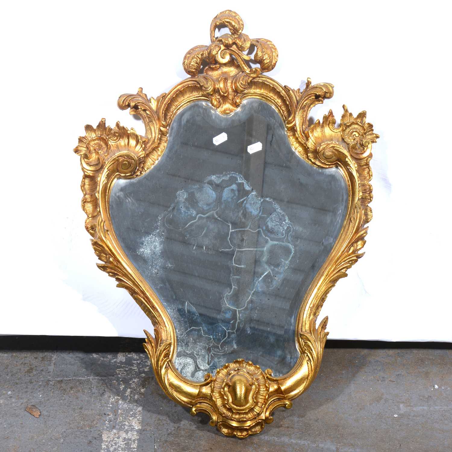 Lot 522 - Cast and gilt metal wall mirror