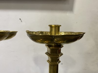Lot 34 - A pair of Victorian Gothic Revival brass altar candlesticks, probably to a design by A.W.N. Pugin
