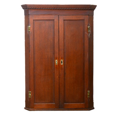 Lot 512 - George III oak hanging corner cupboard.