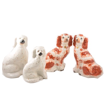 Lot 153 - A pair of Staffordshire flat back spaniels and two others.