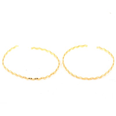 Lot 198 - Two yellow metal open ended, slave bangles.