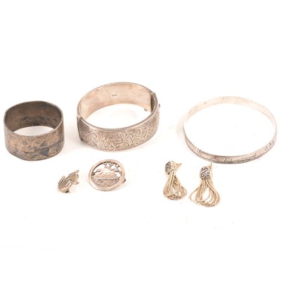 Lot 220 - A collection of silver bangles, ingot, chains.