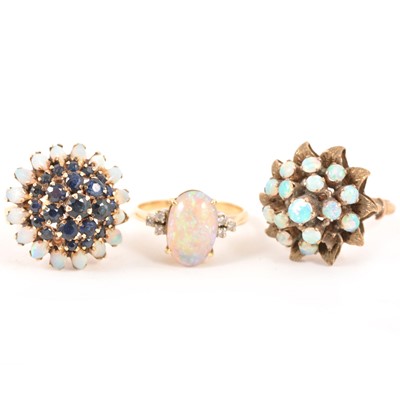 Lot 183 - Three opal dress rings.