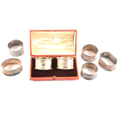 Lot 185 - Pair of Edwardian silver napkin rings, and five other silver napkin rings