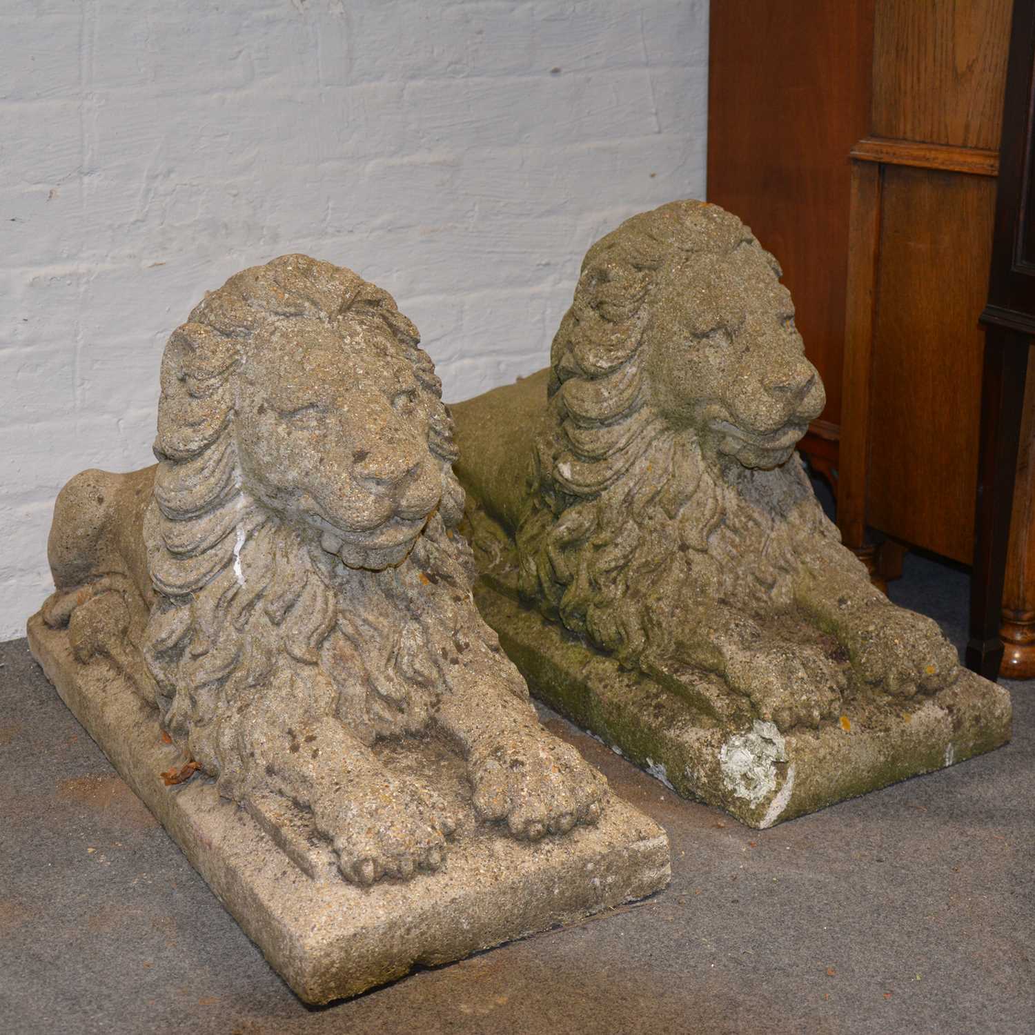 Lot 563 - Two garden lion sculptures