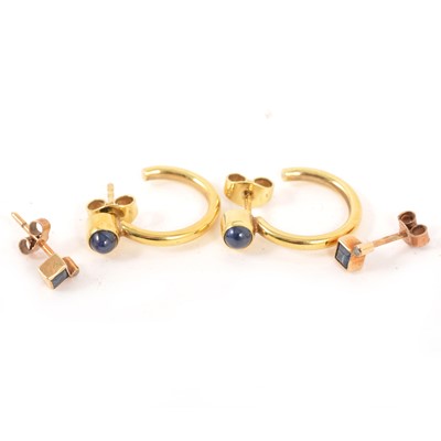 Lot 204 - A pair of modern sapphire earrings and a pair of hoop earrings.