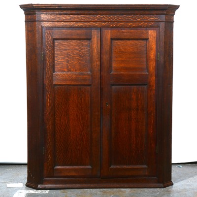 Lot 456 - Late Georgian oak and mahogany hanging corner cupboard