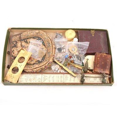 Lot 237 - A tray of collectables, napkin clip, buttons, photo frame, small purse, compass.