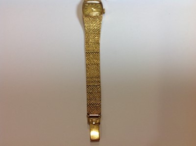 Lot 232 - Rolex - a 9 carat yellow gold bracelet watch.