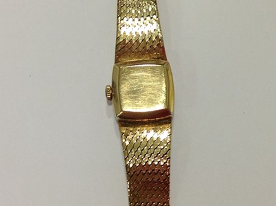 Lot 232 - Rolex - a 9 carat yellow gold bracelet watch.