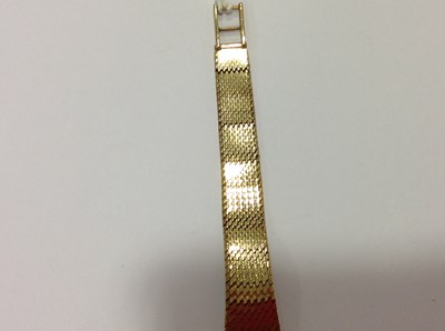 Lot 232 - Rolex - a 9 carat yellow gold bracelet watch.