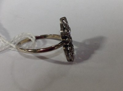 Lot 201 - An Art Deco seven stone diamond ring.