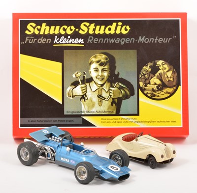 Lot 69 - Three Schuco wind-up tin-plate toys; including Studio Studeo set; no.1050 Mercedes no.6  etc