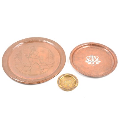 Lot 100 - A Hugh Wallis hammered copper tray with central pewter motif, Johnnie Walker tray and small brass dish.