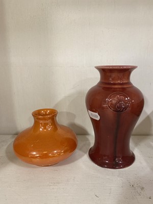 Lot 16 - A William Moorcroft 'Flammian' ware vase for Liberty & Co, circa 1920, and an orange lustre vase