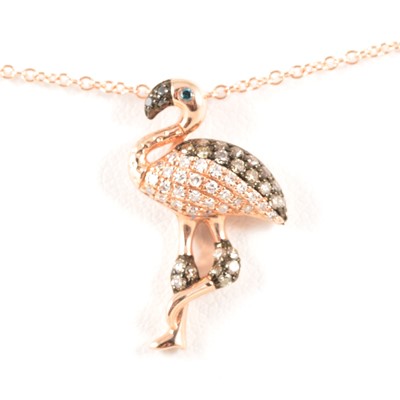 Lot 222 - A chocolate and white diamond novelty flamingo pendant and chain