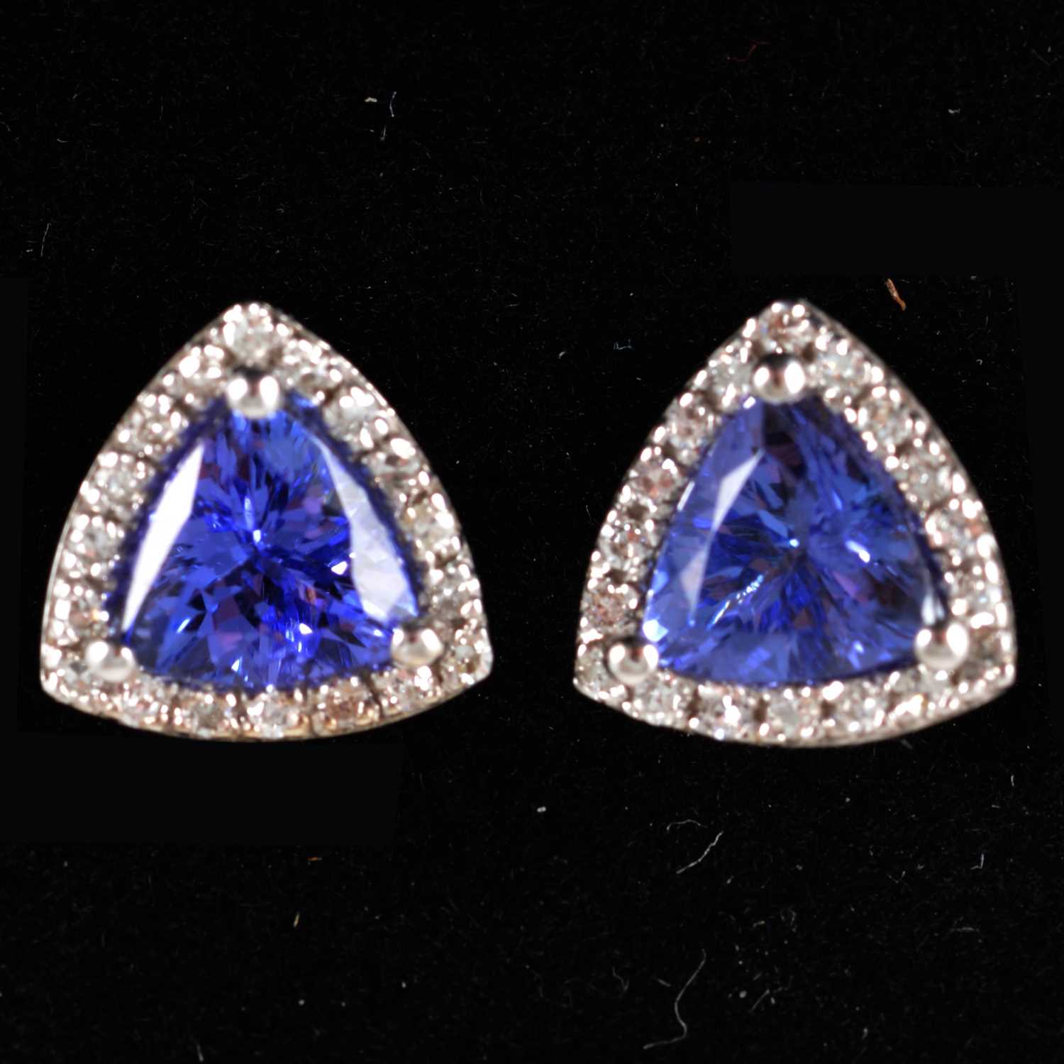 Lot 211 - A pair of tanzanite and diamond cluster earstuds