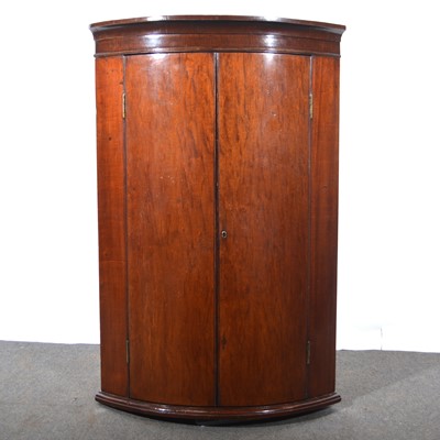 Lot 494 - George III mahogany cylinder front corner cupboard.