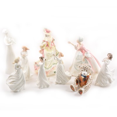 Lot 8 - Eight Royal Doulton figurines, plus a Royal Crown Derby paperweight bear.