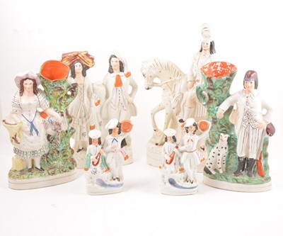 Lot 132 - A collection of Staffordshire pottery vases and figures