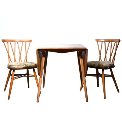 Lot 489 - Ercol dining table and four chairs