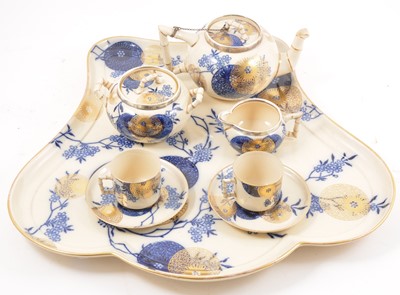 Lot 131 - A Doulton Burslem Aesthetic style breakfast set, silver rims.