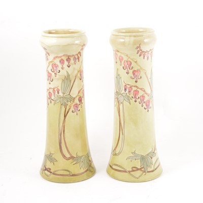 Lot 168 - Doulton Burslem - A pair of Faience vases by Alice Budden, Bleeding Heart design