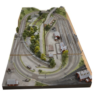 Lot 62 - Large railway layout; comes in four self containing wooden cases, with good landscaping of trees, buildings etc.