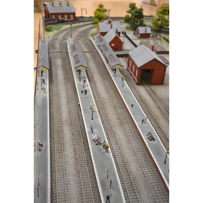 Lot 62 - Large railway layout; comes in four self containing wooden cases, with good landscaping of trees, buildings etc.