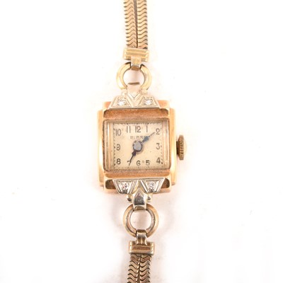 Lot 235 - Birks - A lady's yellow metal wrist watch.