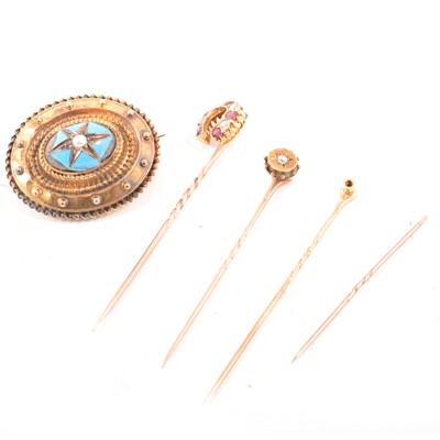 Lot 214A - A ruby and diamond horseshoe stick pin, diamond stick pin and target brooch