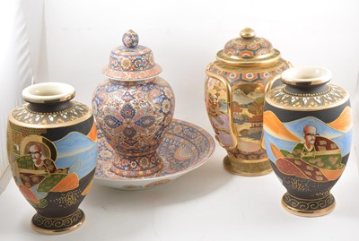 Lot 141 - A pair of Japanese Satsuma vases, a lidded vase, a lidded jar and matching bowl.