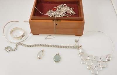 Lot 364 - A collection of silver necklaces, pendants and bangle.