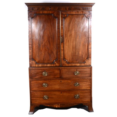 Lot 503 - George III mahogany linen press, adapted as a wardrobe, dentil cornice, plain frieze, two panelled doors to the upper section, two short and two long drawers, bracket feet