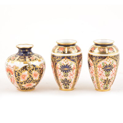 Lot 13 - A pair of Royal Crown Derby Imari design miniature ovoid vases, and a miniature swollen vase.