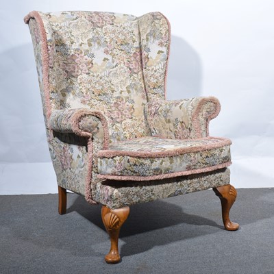 Lot 32 - A Georgian style wing-back chair.